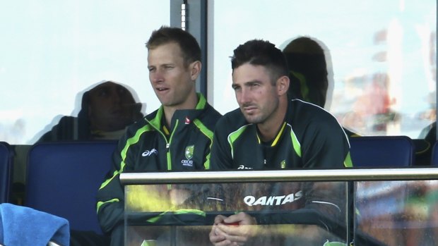 Australia teammates Adam Voges, left,and Shaun Marsh look on from the stands at Edgbaston. Voges' poor form has left him vulnerable to being dropped in favour of his fellow West Australian.