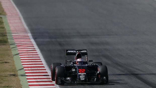 Jenson Button of McLaren-Honda steers his car during a testing session at the Catalunya track in Montmelo just outside of Barcelona.