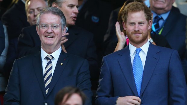 Royal affair: Bernard Lapasset and Prince Harry have a chat during last year's Rugby World Cup.