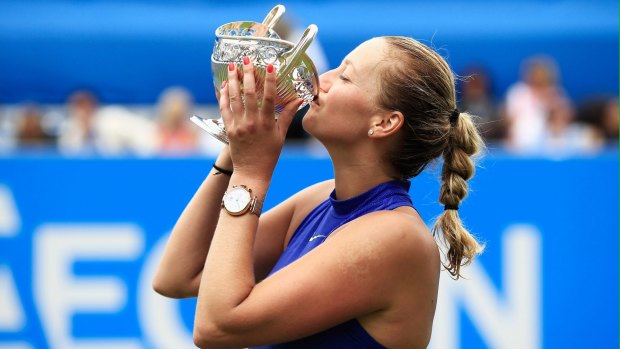 Hand it over: Petra Kvitova of the Czech Republic kisses the trophy after taking out the final against Ashleigh Barty, in the Czech's second tournament back from a hand injury after being stabbed.