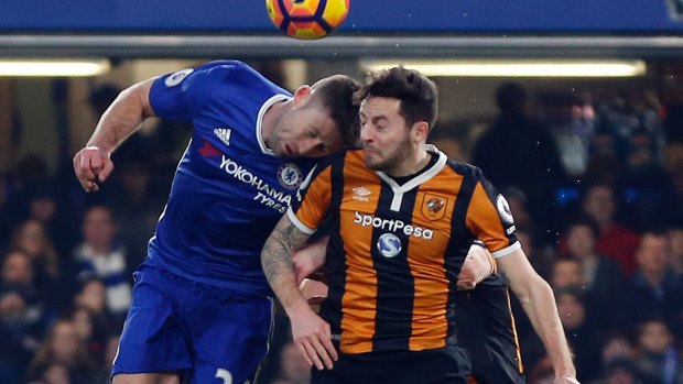 Hull City's Ryan Mason collides with Chelsea's Gary Cahill.