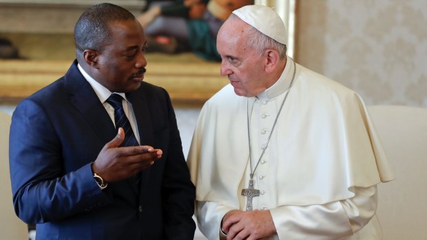 Pope Francis talks with Congolese President Joseph Kabila during a private audience in the pontiff's studio in September.
