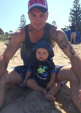 Hunter Reid with his dad Ryan. The little boy loved the beach.