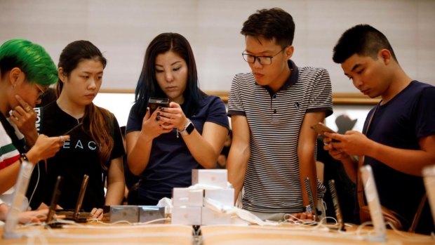 Customers at the Apple Orchard store in Singapore.