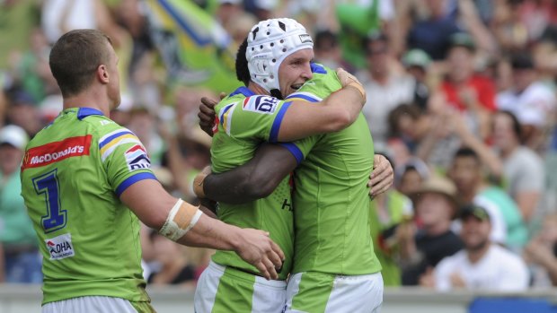 Jarrod Croker is congratulated after scoring against the Roosters on Saturday.