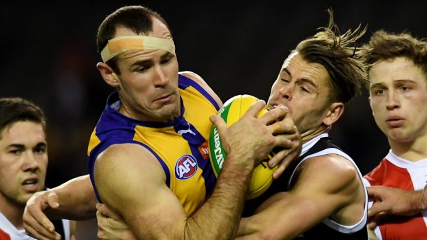 Gotcha: Eagle Shannon Hurn is wrapped up in a tackle against the Saints on Sunday.