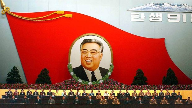 A huge flag-shaped painting featuring Kim Il-sung at an annual meeting to mark the late leader's birthday in North Korea.
