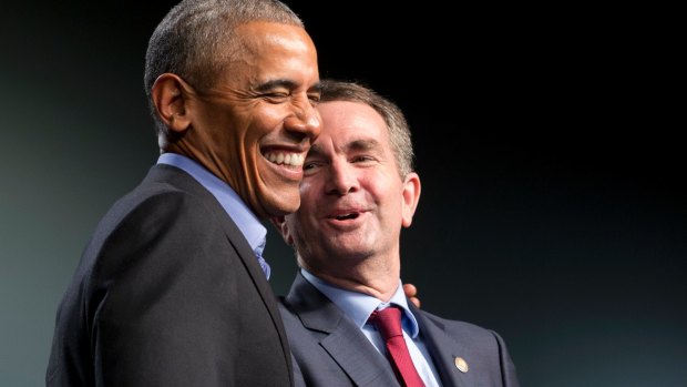 Former president Barack Obama and Democratic gubernatorial candidate Ralph Northam laugh during a rally in an election campaign that was heavily racially charged. 
