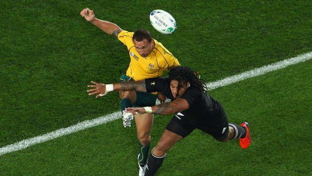 Sparring partners: Cooper clashes with Nonu during the 2011 World Cup semi-final.