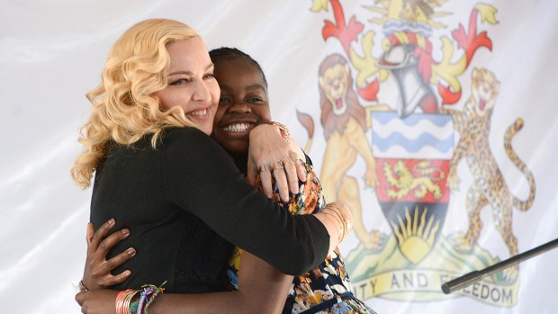 US singer Madonna, hugs her daughter, Mercy, at the opening of The Mercy James Institute for Pediatric Surgery and Intensive Care, located at the Queen Elizabeth Central Hospital in the city of Blantyre, Malawi, Tuesday, July 11, 2017. 