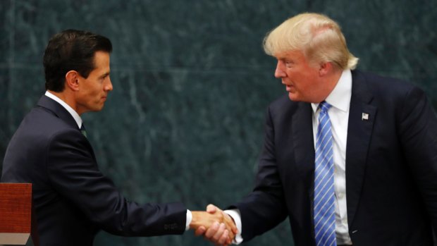 Looking presidential: Mexico President Enrique Pena Nieto and Republican presidential nominee Donald Trump shake hands.