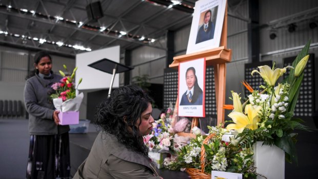 A memorial setup at the Lighthouse Christian College in Cranbourne for Ma Li Dai and her daughter Xinyu Yuan.