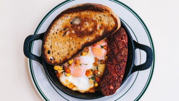 Spanish baked egg, 1904 baked beans, sausage, salsa and toast at Bodega 1904.