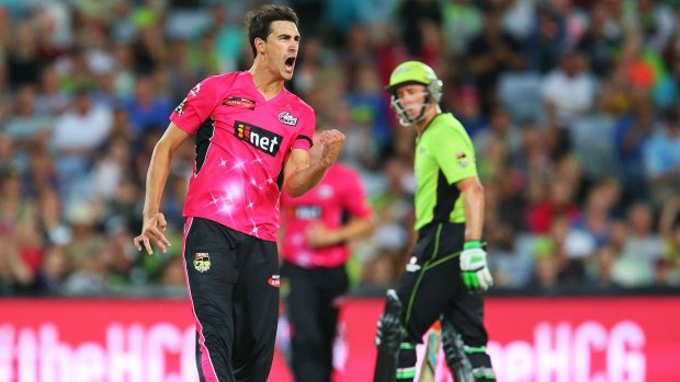Hitting back: Mitchell Starc celebrates after uprooting Jacques Kallis's stumps during the BBL match at ANZ Stadium on Saturday night.