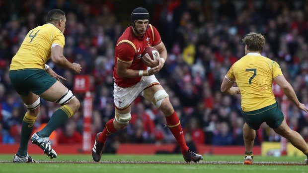 Lion in waiting: Luke Charteris of Wales runs with the ball during the Test against Australia in November.