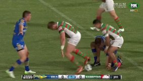 Dazed: Tim Mannah struggling to put his boot on after tackling South Sydney’s George Burgess on Friday night.