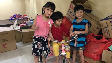 The three youngest children of Tran Thi Thanh Loan and Tran Thi Lua play in the detention centre in Kuningan, South Jakarta.