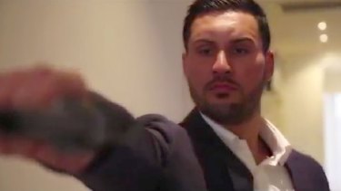In a dramatic scene from the pre-wedding video, Salim Mehajer is depicted holding and firing a gun. 