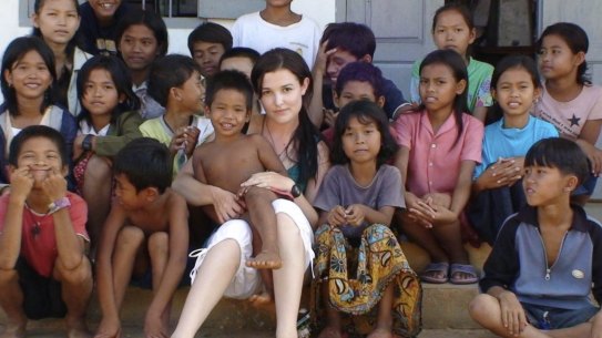 Tara Winkler (seen here with Cambodian children in 2007) set up her own orphanage in  Battambang, in the west of the country, before turning away from centre-based care for children, which she now calls a "trap".