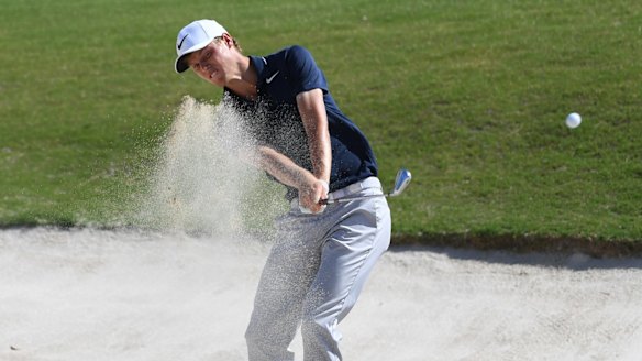 Digging deep: Cameron Davis plays from the bunker on the eighteenth hole at the Australian Golf Club in Sydney.