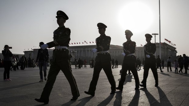 Members of the Chinese People's Armed Police march through Tiananmen Square in Beijing, China