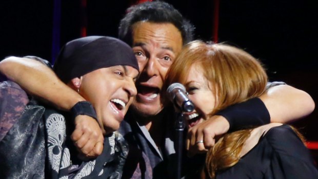 Bruce Springsteen, center, with Patti Scialfa, right, and Stevie Van Zandt from the East Street Band.