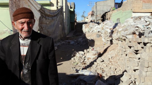 A man stands amid the rubble in Nusaybin, Turkey. 