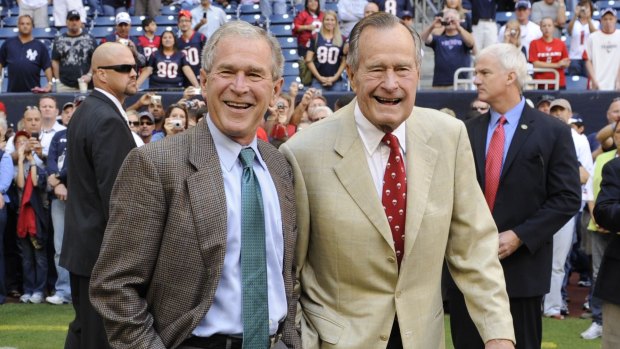 George W. Bush with his father, George H.W. Bush in 2009. 