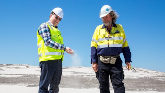 Brisbane's New Parallel Runway project director Paul Coughlan (left) with works inspector Des Hasemann on top of 11 million cubic metres of sand that is ready to become Brisbane's new runway.