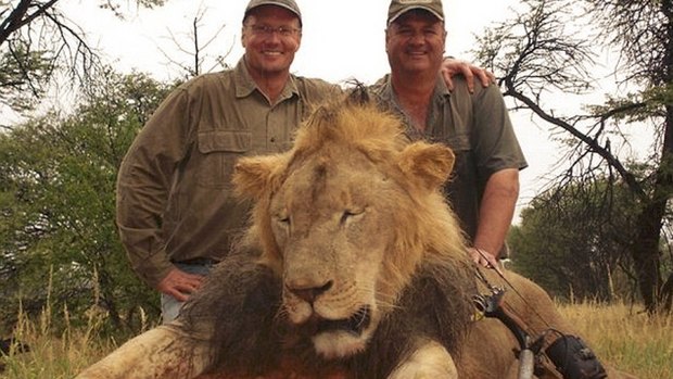 Walter Palmer, pictured left, and a Zimbabwean guide with the lion they killed.