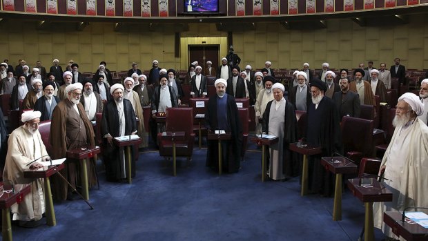 Members of Iran's Assembly of Experts and senior officials stand while listening to the Iranian national anthem in Tehran last week. 
