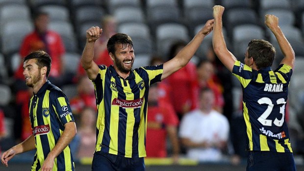 Party time: Antony Golec (centre) and Wout Brama celebrate a goal against Adelaide.