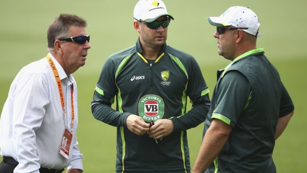 Test captain Michael Clarke talks with selector Rod Marsh (L) and coach Darren Lehmann.