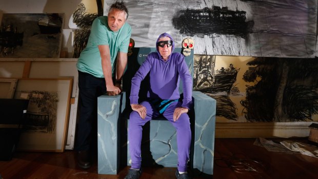 Ghostly canvas: Artists Euan Macleod and Peter Kingston with some of the Phantom-inspired work. 