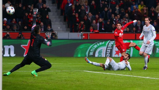 Calhanoglu of Bayer Leverkusen scores the opening goal.