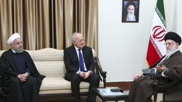 Supreme Leader Ayatollah Ali Khamenei, right, speaks with Swiss President Johann Schneider, centre, as Iranian President Hassan Rouhani listens during their meeting in Tehran, Iran on Saturday.