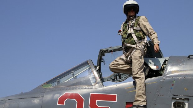 A Russian army pilot in the cockpit of a jet fighter at Hmeimim airbase in Syria. 