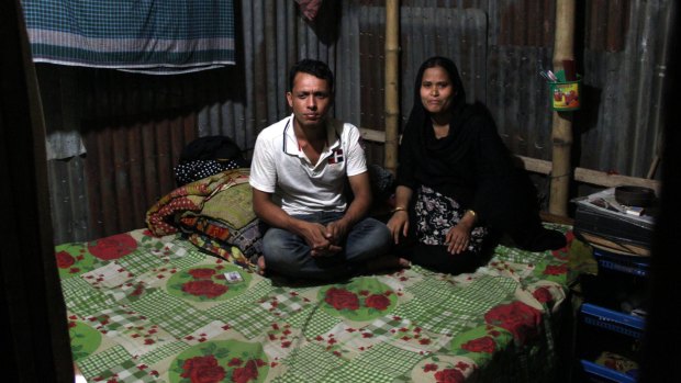 Forhad Mia and his wife Raifa who worked for $65 a month in a factory used by Kmart in 2013. They said their salaries were too low to live on. 