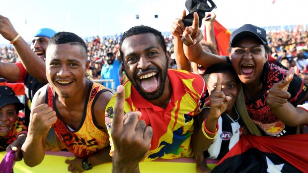 Strong support: Local PNG fans celebrate a home try at Port Moresby.