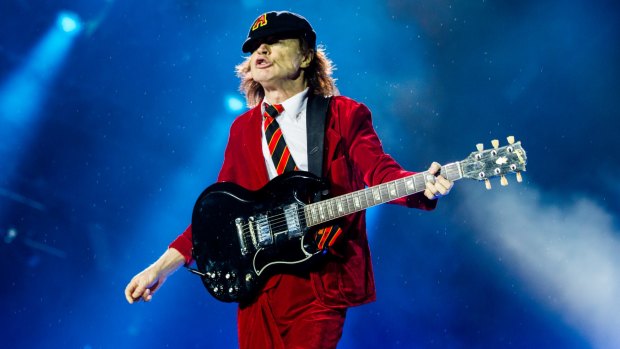 AC/DC guitarist Angus Young with his deep maroon Gibson SG guitar. Balter Beer's head brewer Scott Hargrave once brewed a dark lager inspired by the guitar's deep rosewood colour.