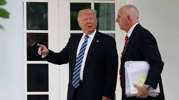 Donald Trump walks with protection officer Keith Schiller to the Oval Office.