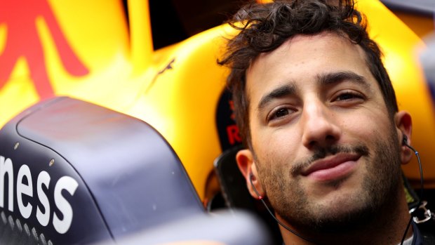 Daniel Ricciardo sits in his car in the garage during day one of the winter testing.