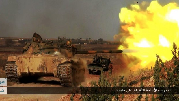 An image posted on the Twitter page of Syrian jihadists shows a rebel tank firing at Syrian troops at Khalsa village, southern Aleppo.