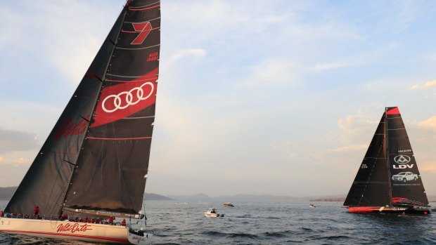 Duelling boats: Wild Oats XI (left) and LDV Comanche duel on the Derwent River on Wednesday.