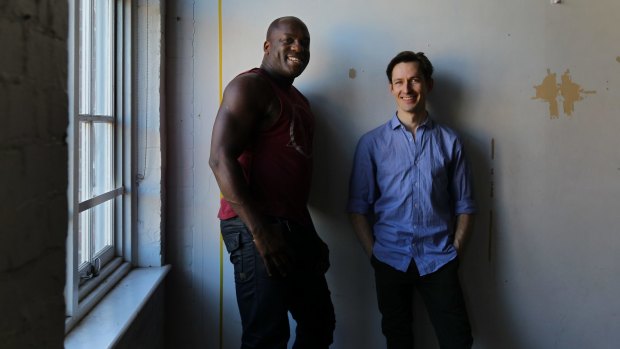 Actors DeObia Oparei (left) and Luke Mullins (right) in <i>Angels in America</i> at Belvoir St Theatre in 2013.