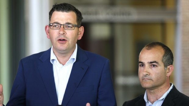 Daniel Andrews and James Merlino have announced a new school funding formula that takes into account  parents' education.
