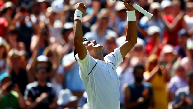 Novak Djokovic of Serbia celebrates winning his first round match over Philipp Kohlschreiber.