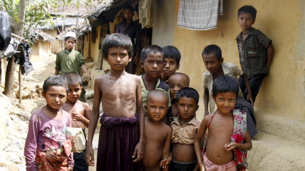 Rohingya children pose for the camera at the Kutupalong refugee camp, Bangladesh, in May.