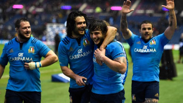 Italy players celebrate after winning their Six Nations match against Scotland at Murrayfield, Edinburgh.