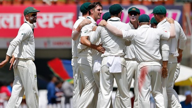 Key player: Australia's Pat Cummins (without cap) celebrates with teammates during the third Test in Ranchi.
